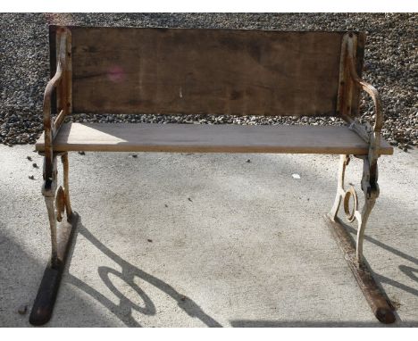 A Victorian iron garden bench, the back folding into a table, stamped 'Geo M Hammer, London', 114cm long