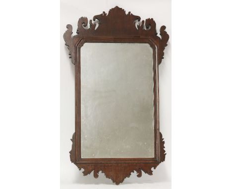 A 'Chippendale' walnut fret framed wall mirror, 78 x 34cm