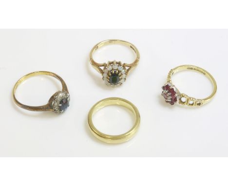 A 9ct gold sapphire and opal cluster ring, an 18ct gold ruby cluster ring, a sapphire and diamond cluster ring marked 18ct pl