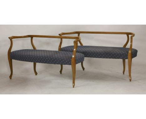 A pair of Art Nouveau window settees, early 20th century, in the style of Guirrand, stylized sculptural fruitwood frame with 