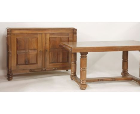 A French Art Deco walnut dining room suite, comprising a table, with pull out ends on turned legs and stretchers, 150cm x 95c