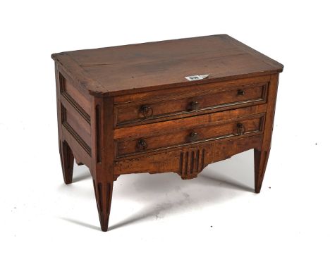 A 19TH CENTURY LOUIS XVI STYLE WALNUT APPRENTICE PIECE OR MINIATURE COMMODETwo long drawers, on tapering fluted legs, 43cm hi