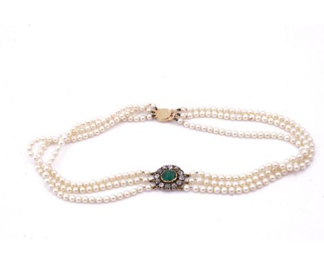 A THREE ROW NECKLACE OF CULTURED PEARLSThe front with a diamond and emerald oval panel, the oval emerald mounted within a sur