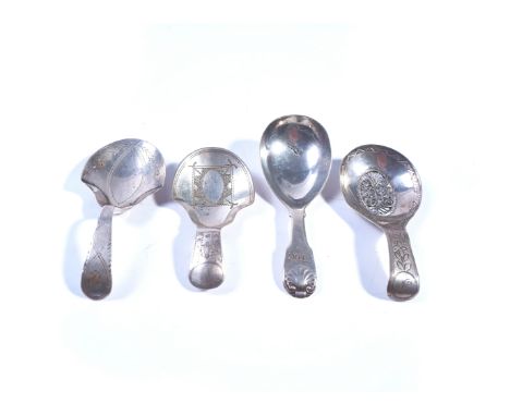 FOUR SILVER CADDY SPOONS (4)Comprising; the first with a filigree oval panel to the bowl, otherwise with engraved decoration,