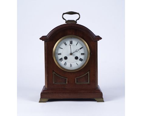 A REGENCY-STYLE MAHOGANY MANTEL CLOCKLate 19th CenturyThe 12cm white enamel dial with Roman numerals, drum-shaped French move