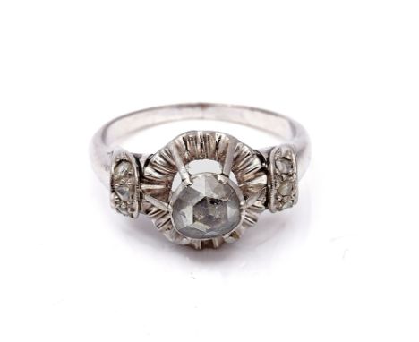 A DIAMOND RINGMounted with the principal rose cut diamond to the centre, between rose cut diamond set three stone shoulders, 