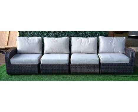 A FAUX RATTAN GARDEN SOFAWith angle adjustable ends and loose cushions, 300cm wide; 80cm high