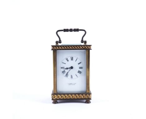 A FRENCH BRASS CASED CARRIAGE CLOCKEarly 20th CenturyThe white enamel dial signed L.N. HOBDAY &amp; CO BIRMINGHAM, the case c
