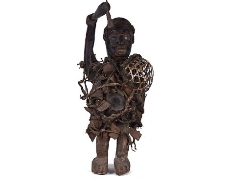 A SONGYE POWER FIGURE, CARVED WOOD, DEMOCRATIC REPUBLIC OF CONGO20th CenturyMounted with mirror glass eyes and stomach, sheet