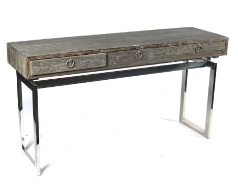 A MODERN LIMED ELM AND POLISHED STEEL CONSOLE TABLEWith three drawers, 160cm wide; 85cm highCondition Report: In good modern 