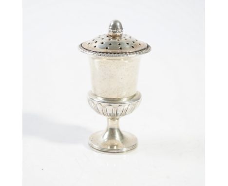 A SILVER PEPPERETTEOf urn shaped form, with partly fluted decoration, raised on a circular foot, the screw-off top with a bud