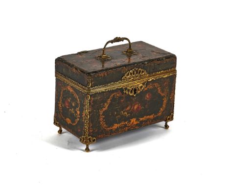 A 19TH CENTURY GILT-METAL MOUNTED JAPANNED RECTANGULAR TEA CADDYWith compartmentalised interior, on claw and ball feet, 21cm 