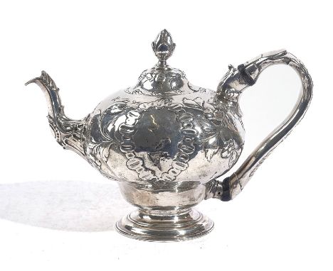 AN EARLY GEORGE III SILVER TEAPOTThe body with floral and foliate decoration and with a bud finial to the lid, London 1765, m