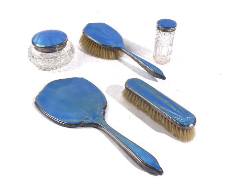 A FIVE PIECE SILVER AND BLUE ENAMEL PART DRESSING SET (5)Comprising; a hand mirror, Birmingham 1937, a clothes brush, a hairb