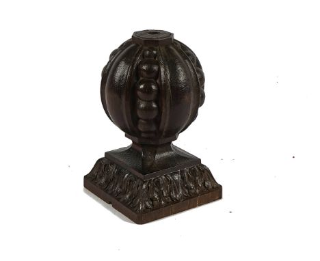 AN 18TH CENTURY CARVED OAK NEWEL POST FINIALOn swept acanthus square base, 17cm wide; 26cm high