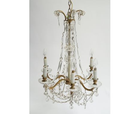A GILT-METAL AND CUT-GLASS SIX-LIGHT CHANDELIER20th CenturyThe six scroll branches hung with faceted glass drops, fitted for 