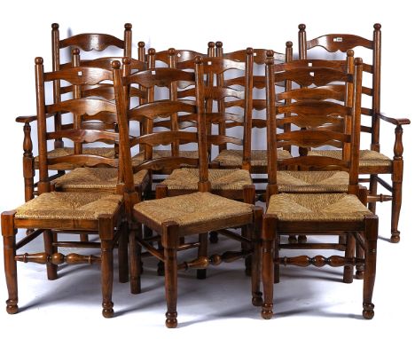 A SET OF TEN OAK AND ASH LANCASHIRE LADDER BACK DINING CHAIRS (10)With rush seats and turned supports, including a pair of ca