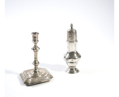 A GEORGE III SILVER SUGAR CASTER AND A VICTORIAN SILVER TAPER STICK (2)The caster of baluster form, crest engraved, London 17