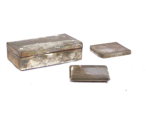 A SILVER TABLE CIGARETTE BOX AND TWO SILVER CIGARETTE CASES (3)The rectangular cigarette box wooden lined within and presenta