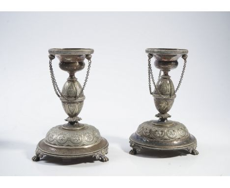 A PAIR OF PLATED STANDS AND A PLATED CASED ITEM (2)The Victorian plated stands with pendant chains, floral and foliate decora
