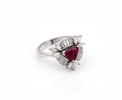 A WHITE GOLD, RUBY AND DIAMOND RINGClaw set with the triangular cut ruby in a surround of baguette and marquise shaped diamon