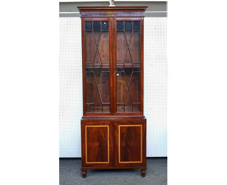 A 19TH CENTURY INLAID MAHOGANY BOOKCASE CABINETThe associated top with pair of astral glazed doors over two door base, 105cm 