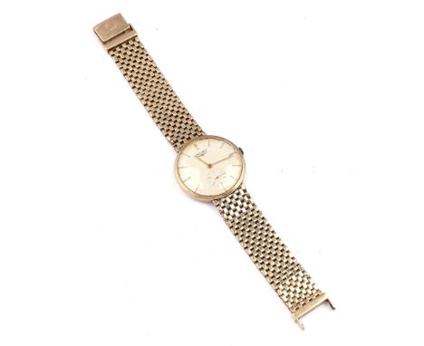 A 14K GOLD LONGINES GENTLEMAN'S BRACELET WRISTWATCHThe signed silvered dial with gilt baton numerals, gilt hands and with sub