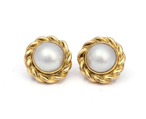 A PAIR OF 9CT GOLD AND MABE PEARL EARCLIPSEach mounted with a mabe pearl at the centre within a ropetwist surround, the backs
