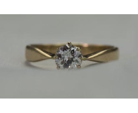 18ct Gold Set Single Stone Diamond Ring. The Single Round Brilliant Cut Diamond of Good Colour and Clarity. Estimated Diamond