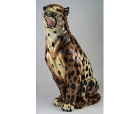 A Large and Realistic Hand Painted Ceramic Figure of a Leopard In a Sitting Position Growling. Height 23.5 Inches. 
