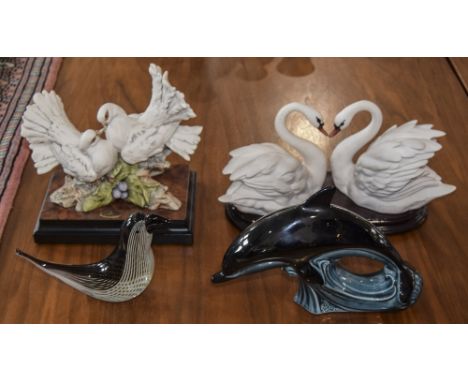 Two Florence Giuseppe Armani Ceramic Figures, Swans and Birds. Raised on Wooden Plinths. Together with Poole Ceramic Dolphin 