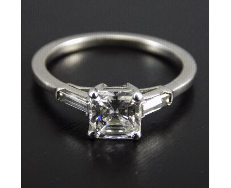 Ladies White Gold Diamond Ring, Set With A Central Asscher Cut Diamond Between 2 Baguette Cut Diamond Shoulders, Estimated Di