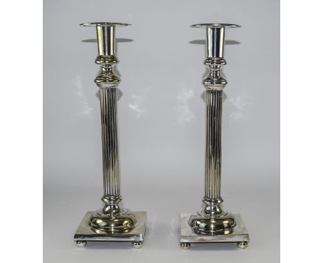 A Fine and Impressive Pair of Silver Plated Corinthian Column Candlesticks, Raised on a Square Base, Supported by 4 Ball Feet