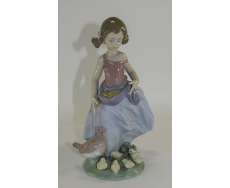 Lladro Figurine "Afternoon Snack" Girl Feeding Chickens. Model Number 6577. Issued 2000. Retired 2003. Sculptor Antonio Ramos