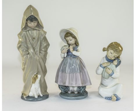 Nao by Lladro Figures ( 3 ) In Total. 1/ Boy Wearing a Hood and Cloak, with Small Dog at Feet. 10.5 Inches High. 2/ Young Gir