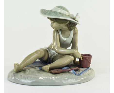 Lladro Figure "Sandcastles" Model Number 5488. Sculpted By Regino Torrijos. Issued 1988-1992. Height 5.5 inches, Width 6 inch
