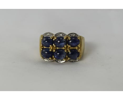 9ct Gold Set Cabochon Cut Sapphires and Diamond Cluster Ring. The Six Cabochon Cut Sapphires with Diamond Spacers. Ring Size 