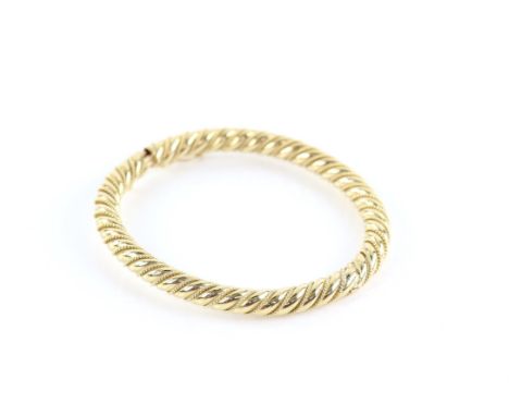 Twist design hinged bangle, with a concealed box clasp and safety catch, inside diameter 59 x 51mm, testing as 9 ctCondition 