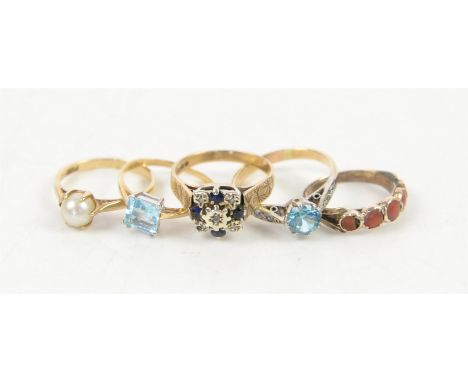 Five gem set rings, including a blue zircon ring, set with two white zircons on each side, ring size N, a single stone blue t