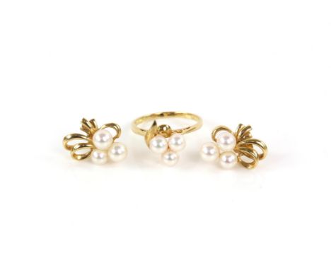 Mikimoto ring and earrings, the earrings each have three Akoya pearls and ribbon detail, screw back fittings and are signed M