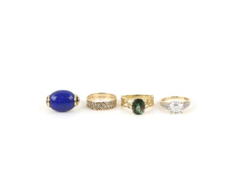 Four rings, one set with an oval cut Andesine, open work shoulder details, size N 1/2, with a oval cabochon cut lapis and dia