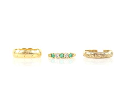 Three rings including, emerald and diamond half eternity, set with three round cut emeralds and two round brilliant cut diamo