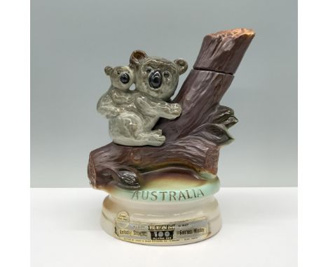 A heartwarming decanter depicting a gray mother koala with her joey on her back, climbing a tree trunk in search of food, wit