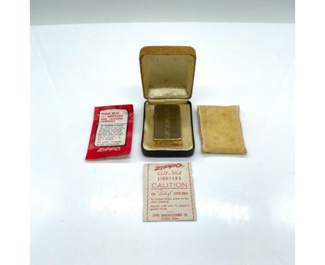 Beautiful lighter with an engraved pattern. It includes the original protective bag, instructions, and box which measures 3"L