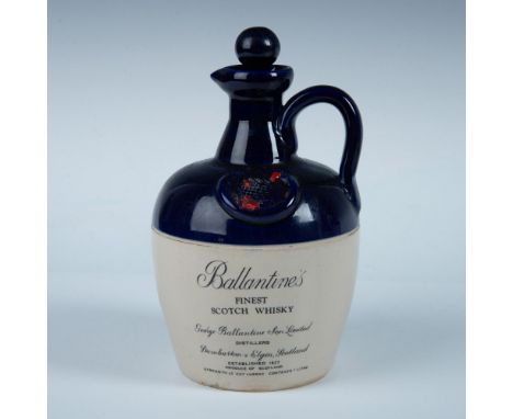 Empty ceramic bottle and stopper decorated with cobalt blue glaze over clear glazed ceramic. Dimensions: 9"H x 5.25" dia. Con