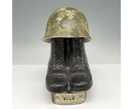 Unique soldier related bottle was released to commemorate the end of the Vietnam War. The bottle originally contained 100-mon