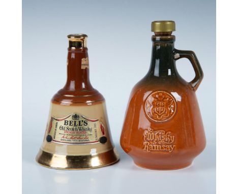 The Bell's Old Scotch Whisky bottle features a bell shape in brown and mustard coloration, adorned with gold accents, measuri