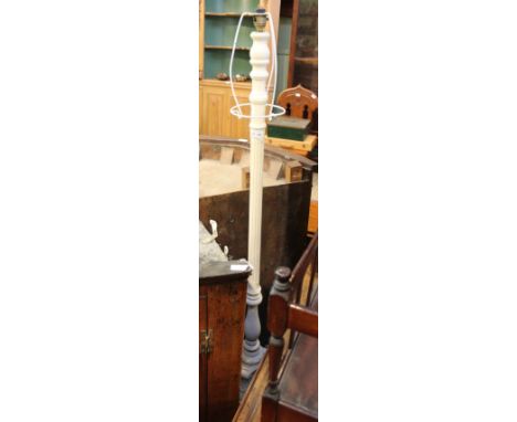 An ivory white painted reeded standard lamp on tricorn carved base 
