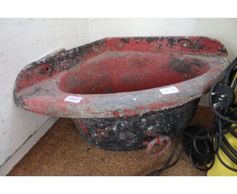 A painted cast metal corner trough 