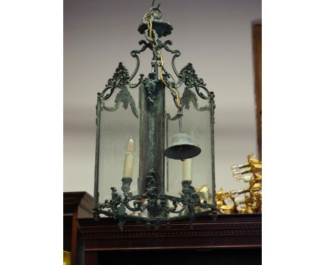 A patinated brass Rococo design ceiling light pendant, 30" long 